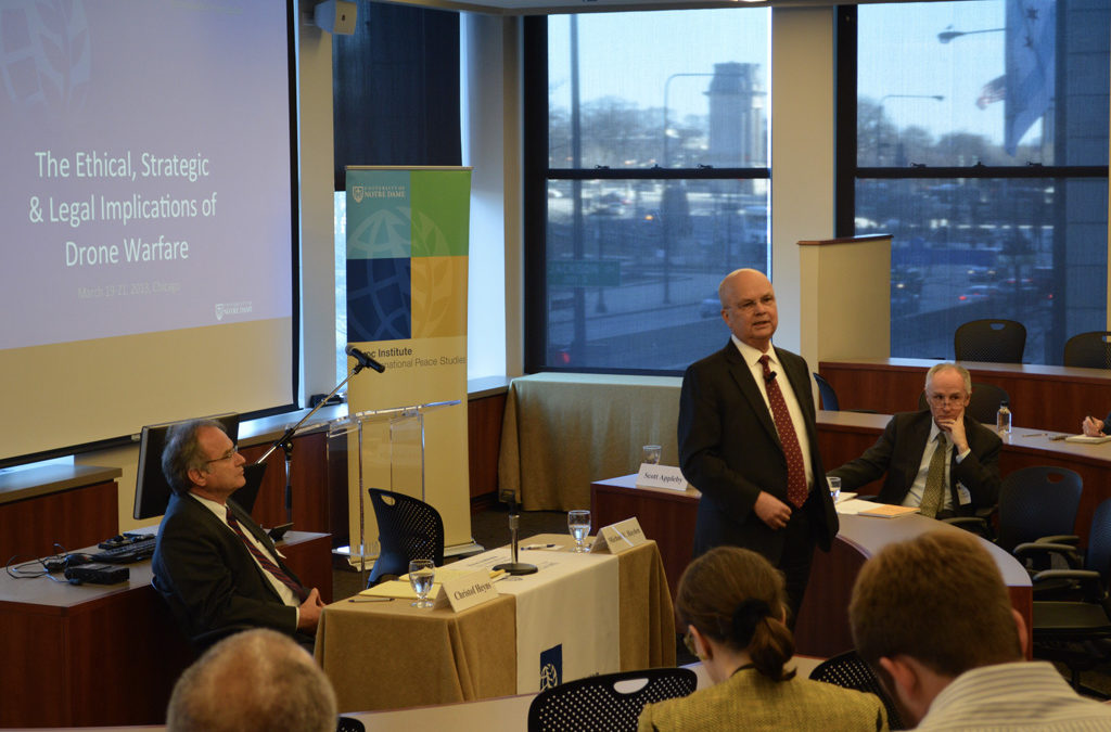 Gen. Michael V. Hayden (USAF, ret.), former director of the CIA (standing), with Christof Heyns, UN Special Rapporteur (left), and David Cortright (right), director of policy studies at the Kroc Institute.