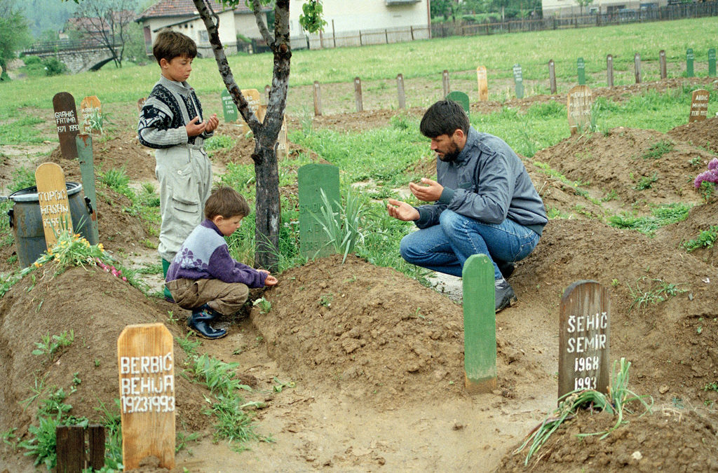 A Muslim grieving over his son's grave in Vitez