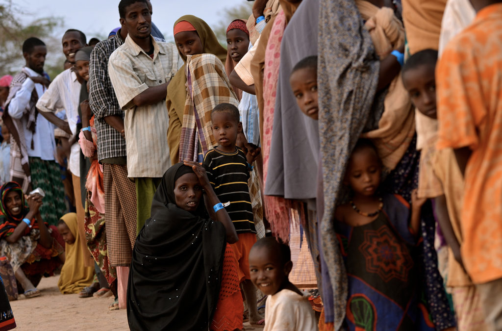 Hundreds of people fleeing drought, famine and a civil war in Somalia wait in line at dawn to register at Ifo refugee camp in Dadaab, Kenya. According to the United Nations, 3.7 million Somalis are in crisis.